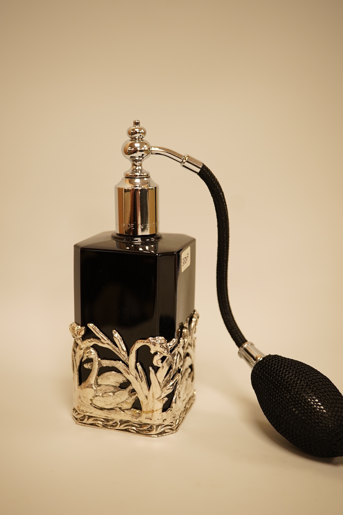 A collection of decorative glass and metal perfume bottles, miniature frames and pill boxes, green glass perfume bottle 15.5cm high.